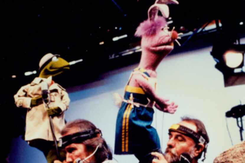 Jim Henson (left, with Jerry Nelson) created engaging puppet characters that entertained...