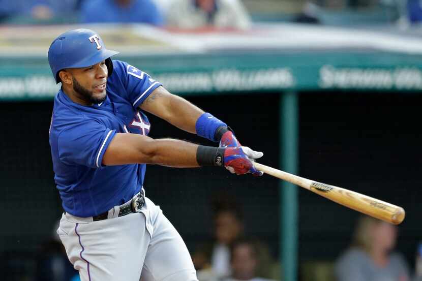Texas Rangers' Elvis Andrus hits a three-run home run off Cleveland Indians starting pitcher...