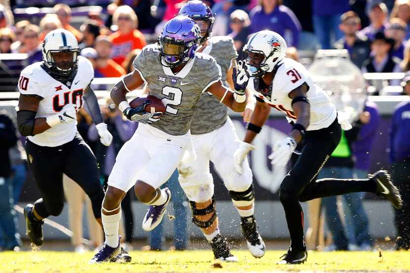 TCU Horned Frogs wide receiver Taj Williams (2) cuts back against the Oklahoma State Cowboys...