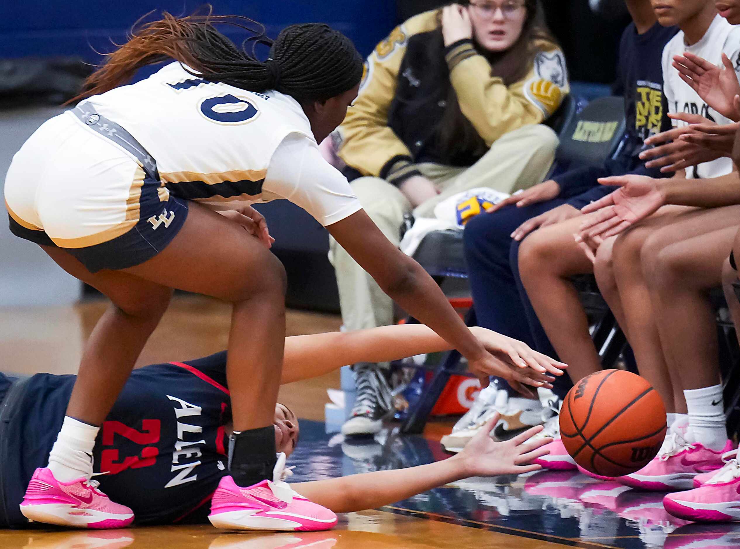 Allen’s Aryn Roberts (23) loses a loose ball out of bounds against Little Elm's Amina Diallo...
