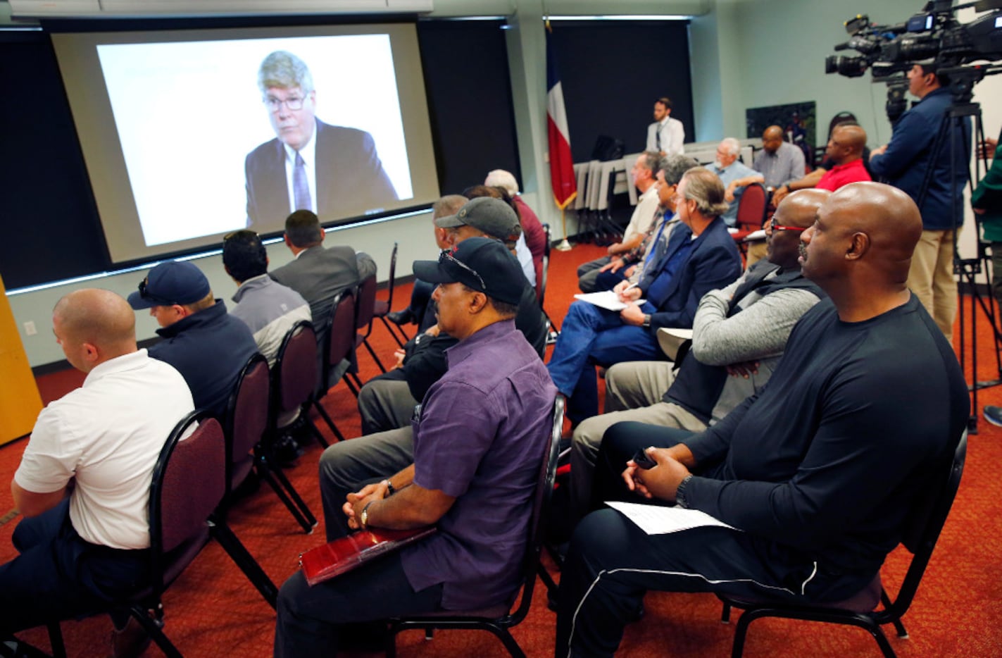 Dallas Police and Fire Pension System members watch a series of videos created to help...