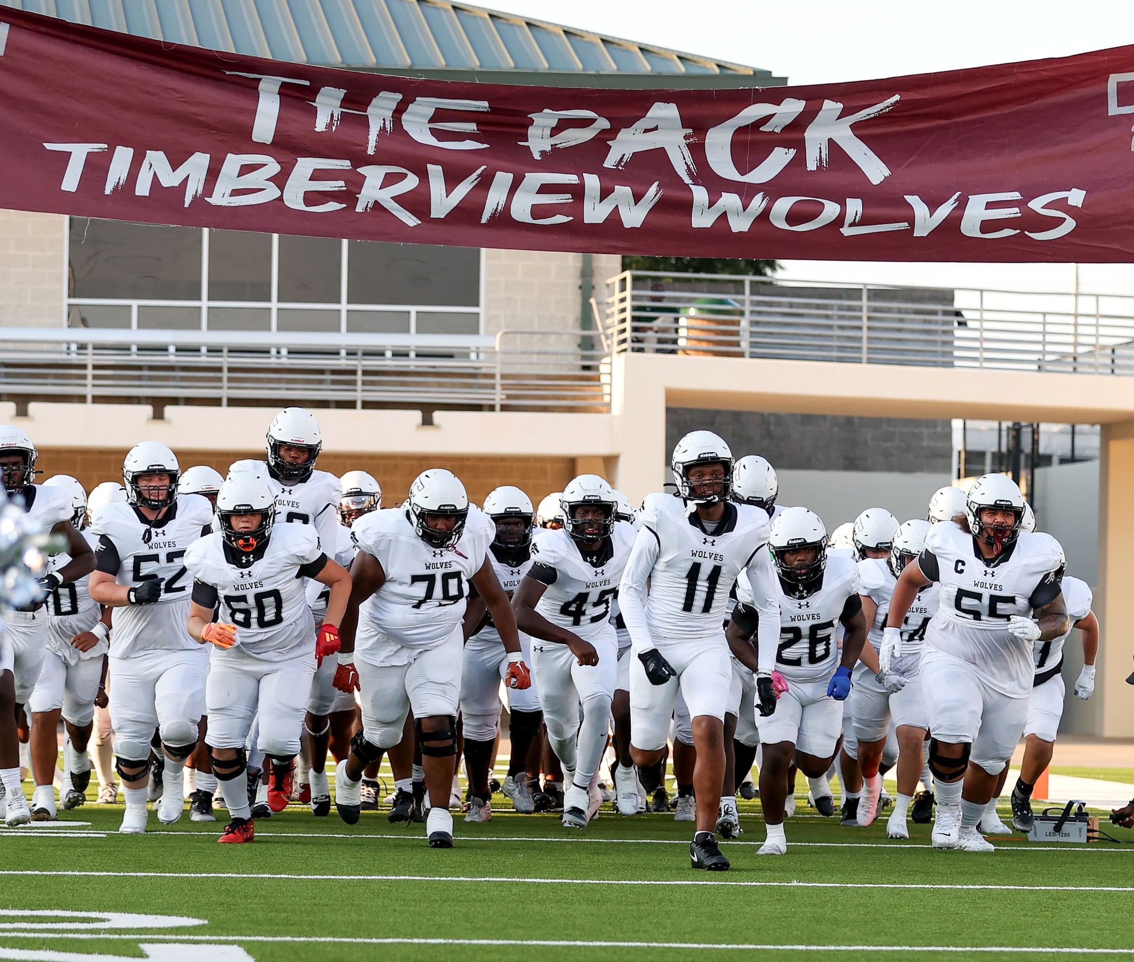 The Mansfield Timberview Wolves enter the field to face Denton Ryan in a high school...