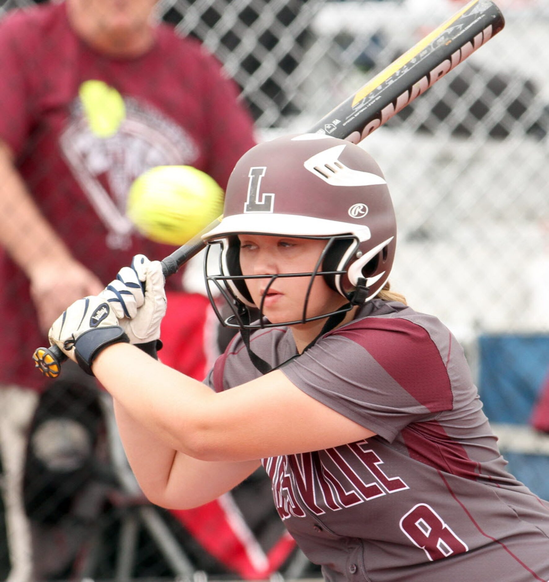 Lewisville's Emily Powers (8) watches as a pitch races by out of the strike zone while...