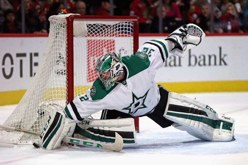 CHICAGO, IL - FEBRUARY 11:  Kari Lehtonen #32 of the Dallas Stars makes a save against the...