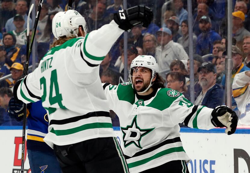 Dallas Stars' Roope Hintz, of Finland, is congratulated by Mats Zuccarello, right, after...