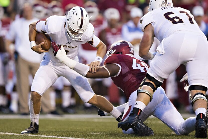 FAYETTEVILLE, AR - SEPTEMBER 17:  Deatrich Wise Jr. #48 of the Arkansas Razorbacks sacks...