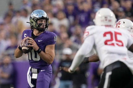 TCU quarterback Josh Hoover (10) drops back to pass as Houston linebacker Jamal Morris (25)...