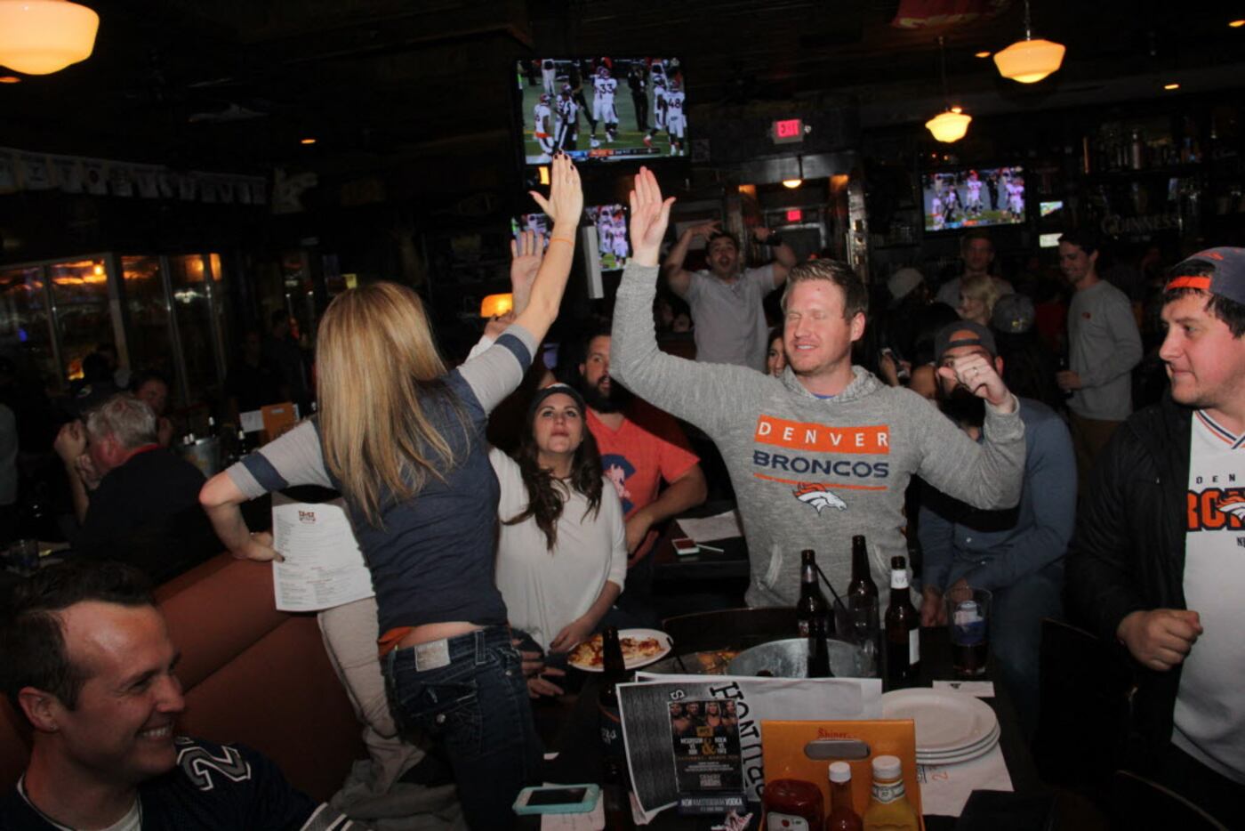 Broncos fans celebrate at the Super Bowl 50 watch party at Henderson Tap House on February...