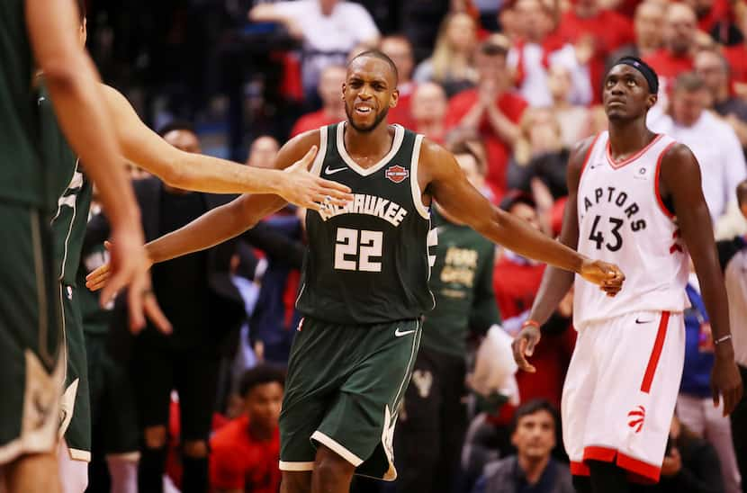 TORONTO, ONTARIO - MAY 19: Khris Middleton #22 of the Milwaukee Bucks celebrates with...