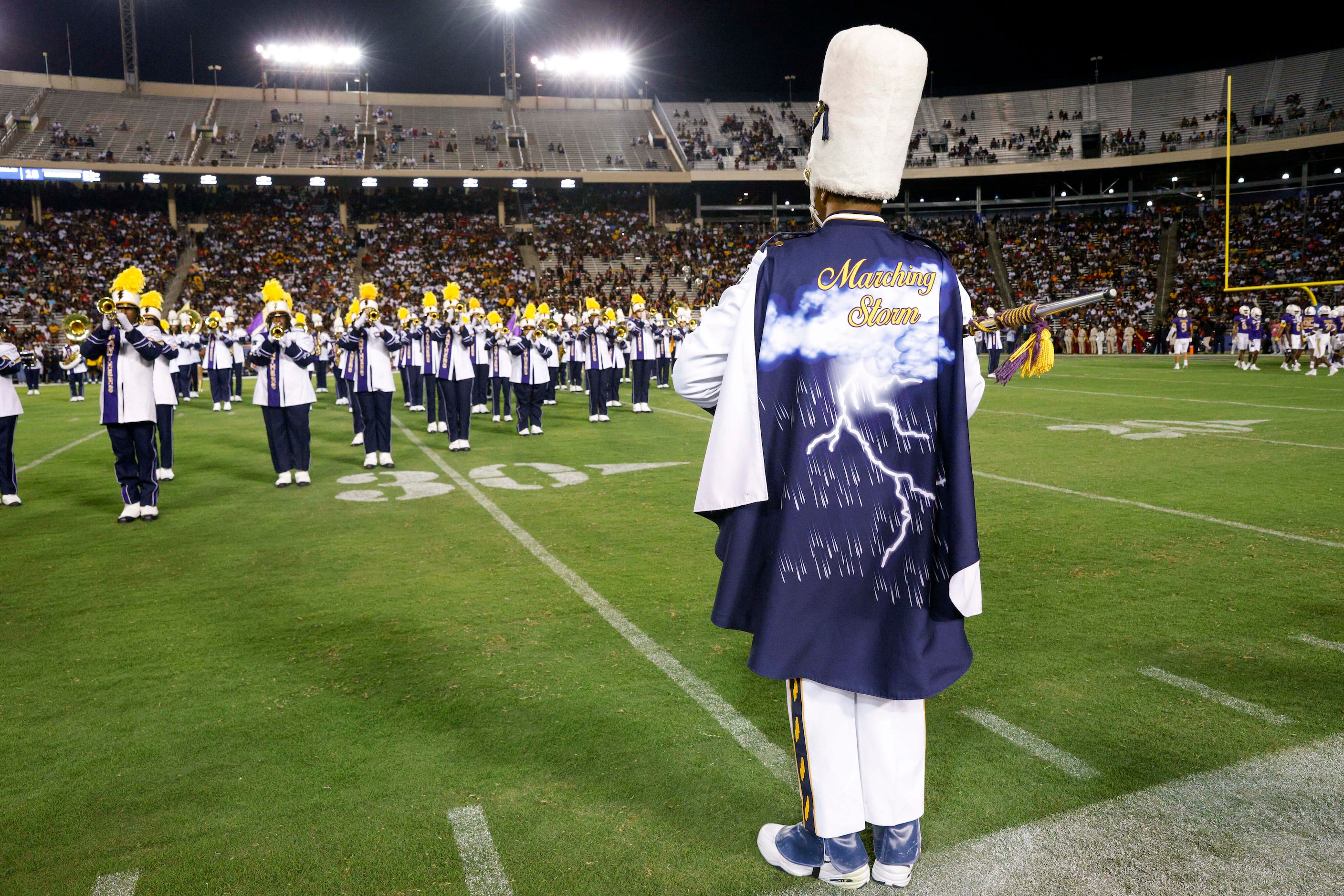 A Prairie View A&M marching band drum major watches over the performance during halftime at...