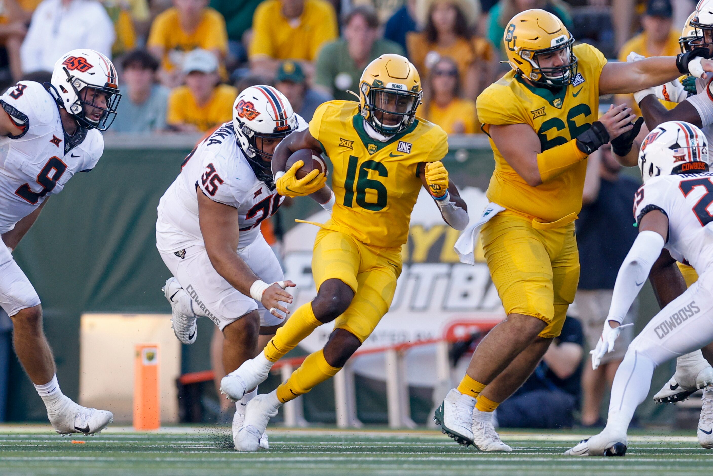 Baylor wide receiver Hal Presley (16) runs past Oklahoma State defensive tackle Samuela...