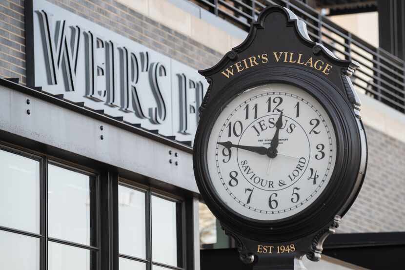 A restored clock from the old Weir's Furniture store is on display outside the new store on...