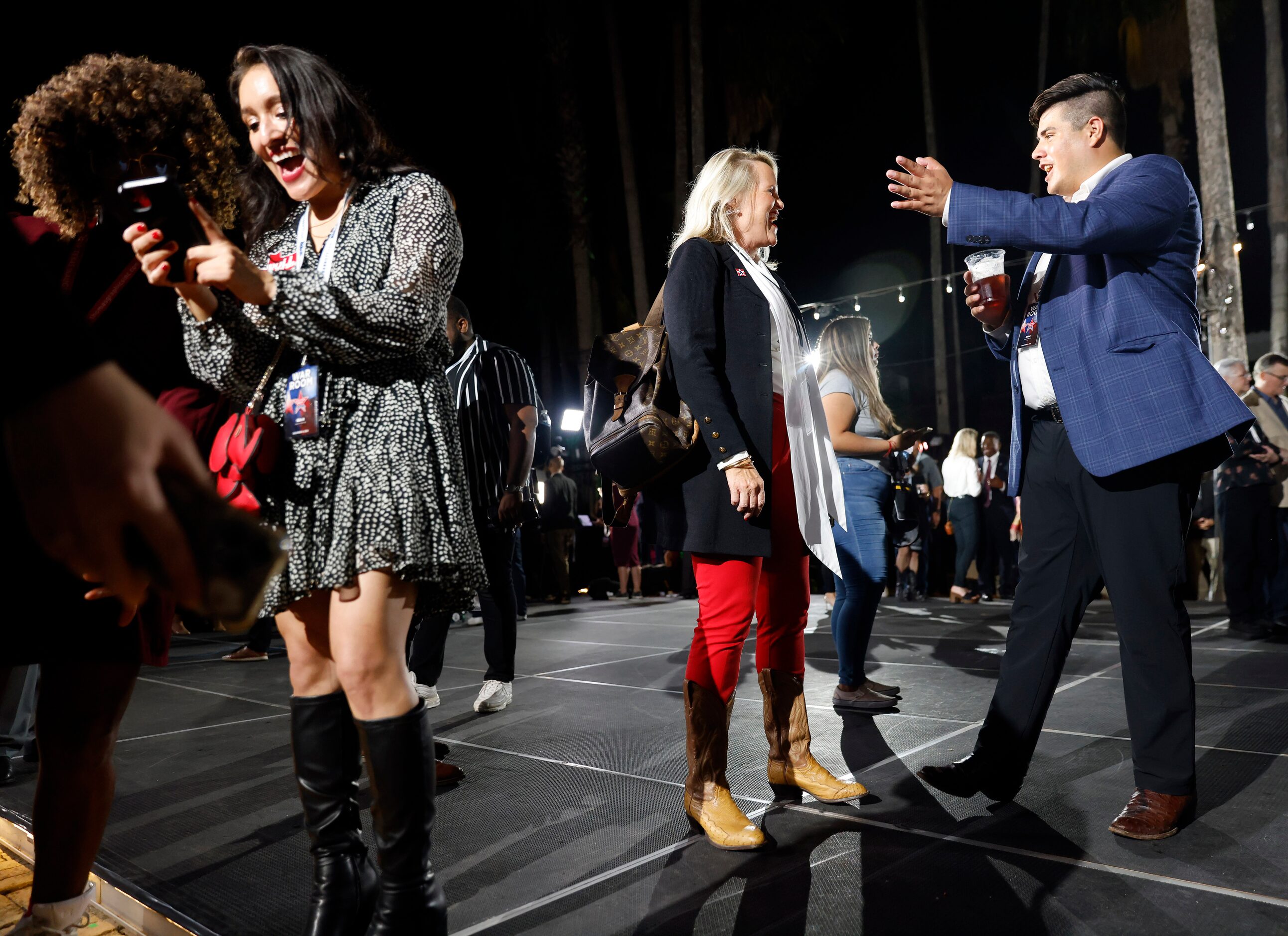 Supporters enjoyed themselves after seeing the results of Texas Governor Greg Abbott’s...