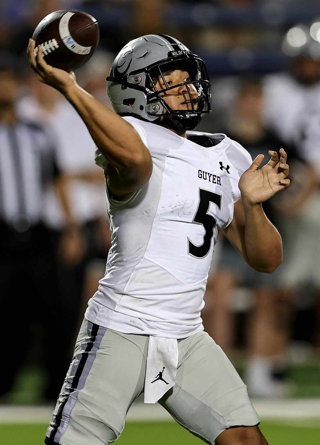 Denton Guyer quarterback Isaac Harney attempts a pass against Allen during the first half of...