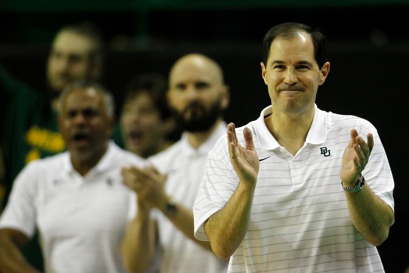 Baylor head coach Scott Drew applauds his players during first half action against Alcorn...