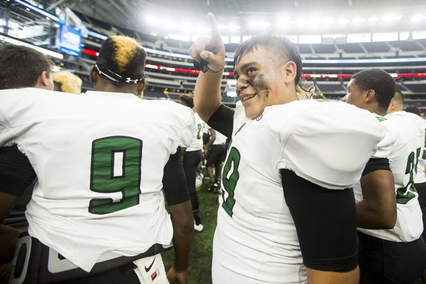 Poteet's Jonathan Cardenas (59) reacts to cheers from the crowd after the 5A Division 1...