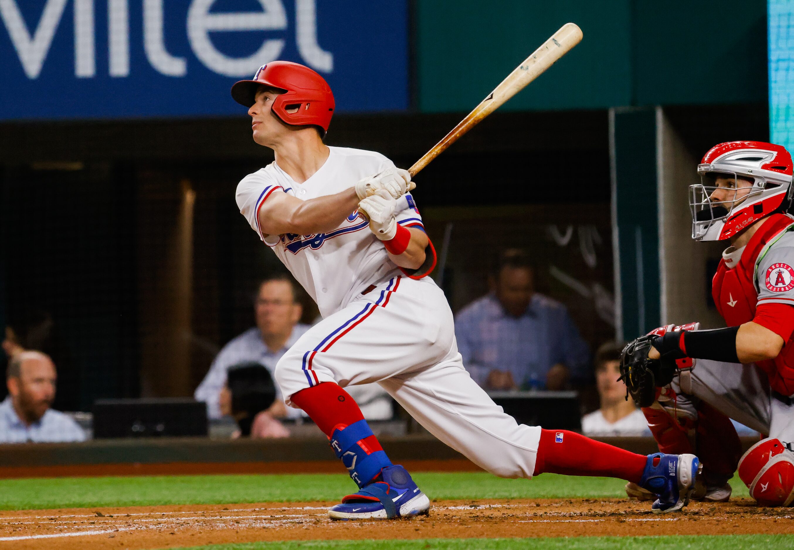 Texas Rangers second baseman Nick Solak (15) looks up after hitting a homer on a fly ball to...