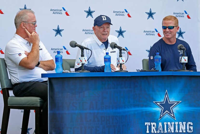 Cowboys owner Jerry Jones, center, speaks as head coach Jason Garrett, right, and executive...