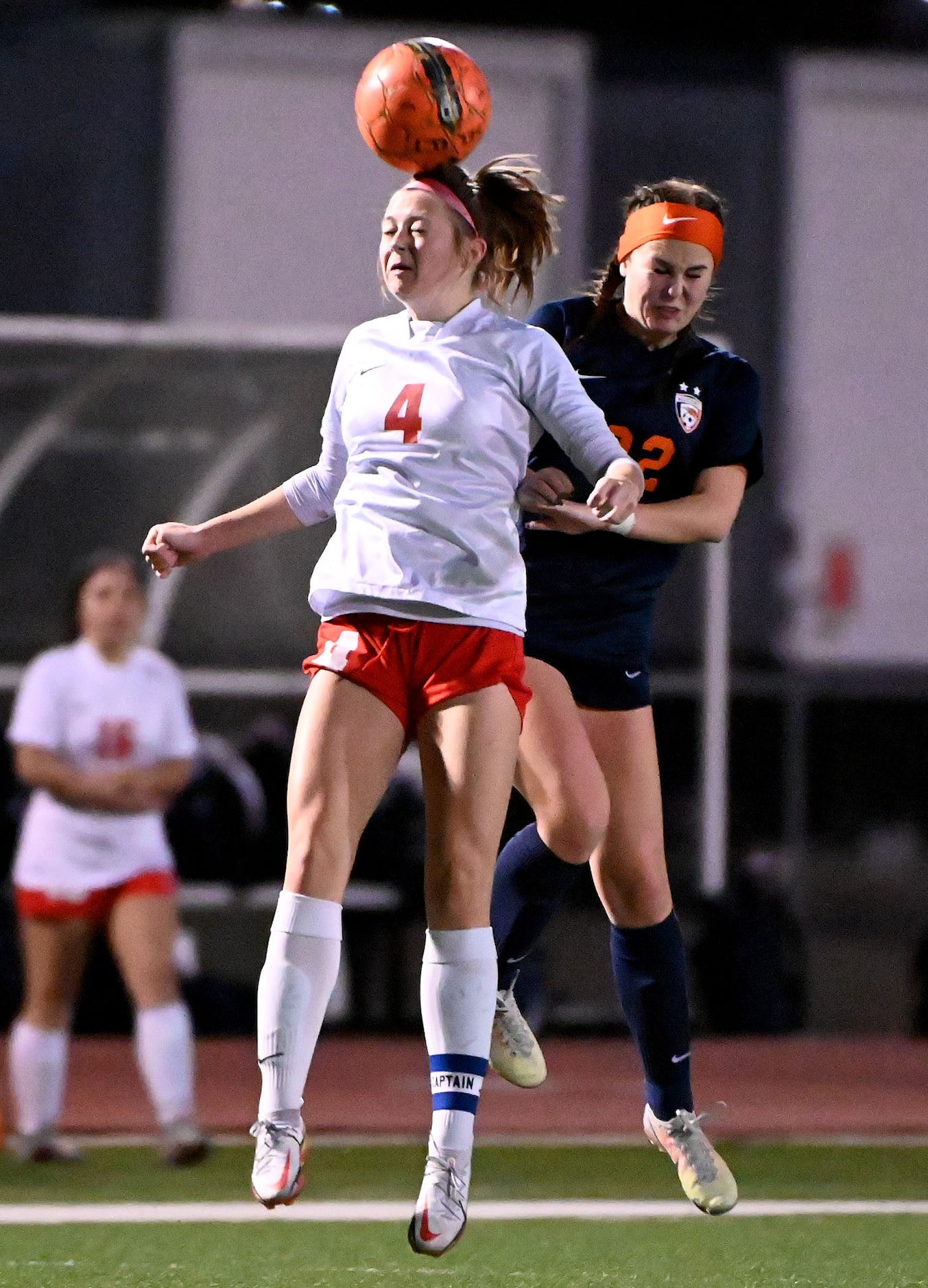 Frisco Centennial’s Devin Cybulski (4) gets to a header in front of Frisco Wakeland’s...