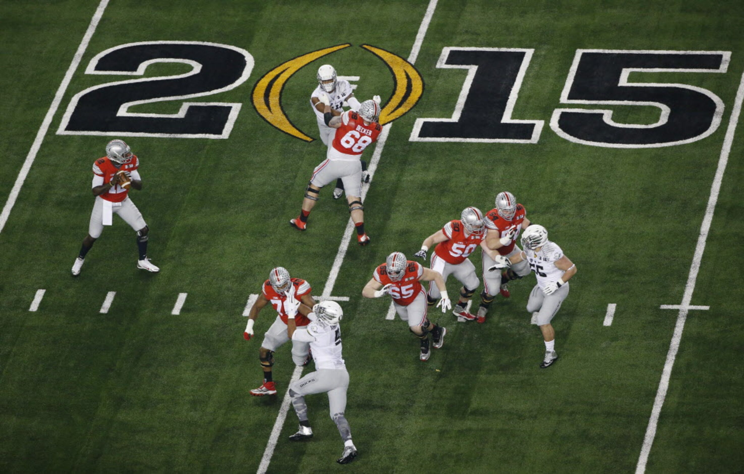 Ohio State Buckeyes quarterback Cardale Jones (12) looks to throw the ball in the first...