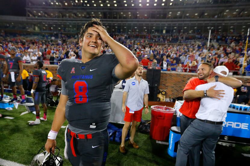 Southern Methodist Mustangs quarterback Ben Hicks (8) seems relieved and excited about their...