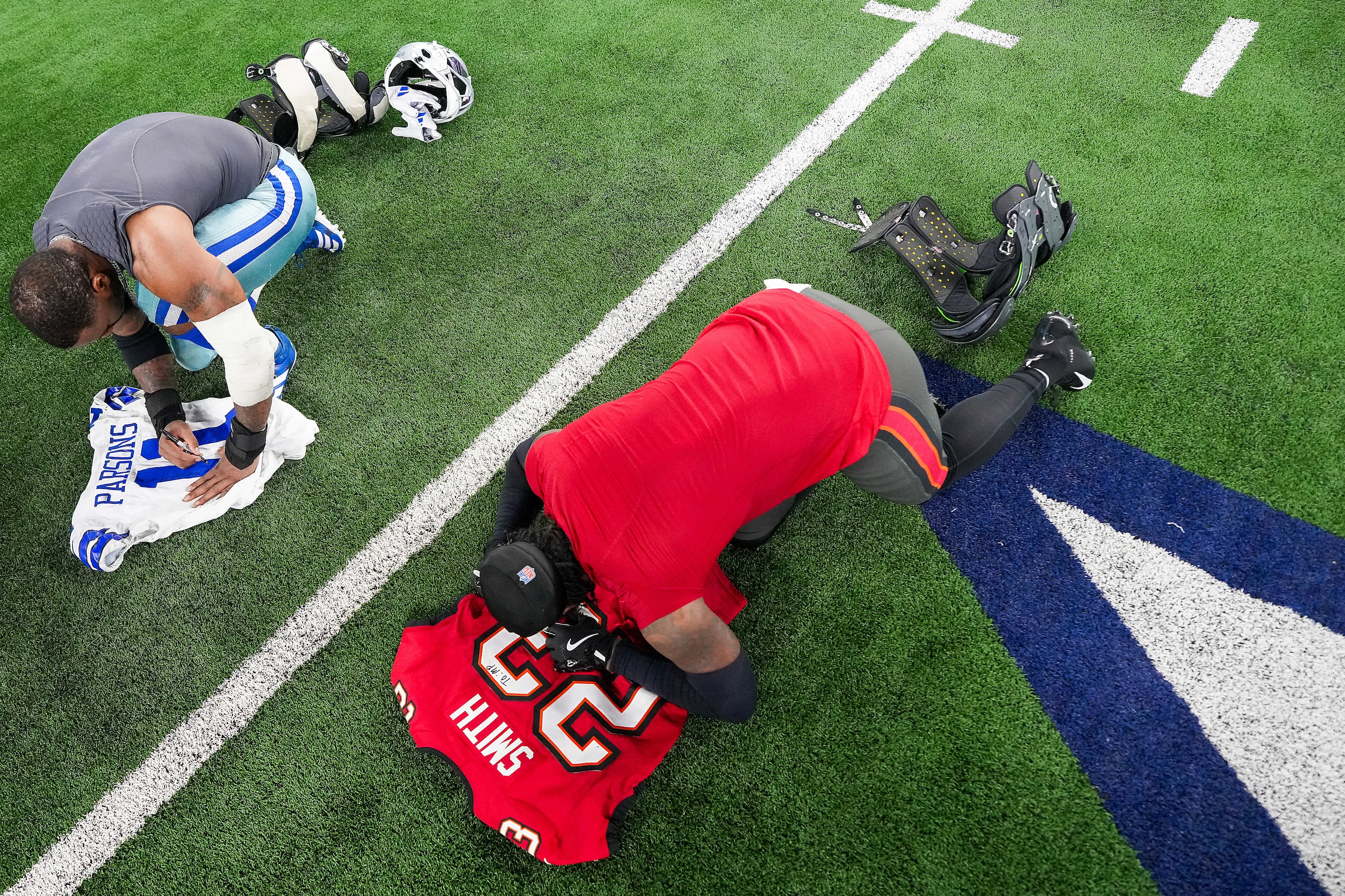 Dallas Cowboys linebacker Micah Parsons (11) exchanges jerseys with Tampa Bay Buccaneers...