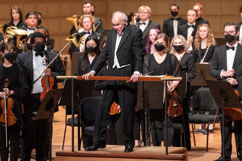 Conductor Paul Phillips takes a bow before leading the SMU Meadows Symphony Orchestra, on a...