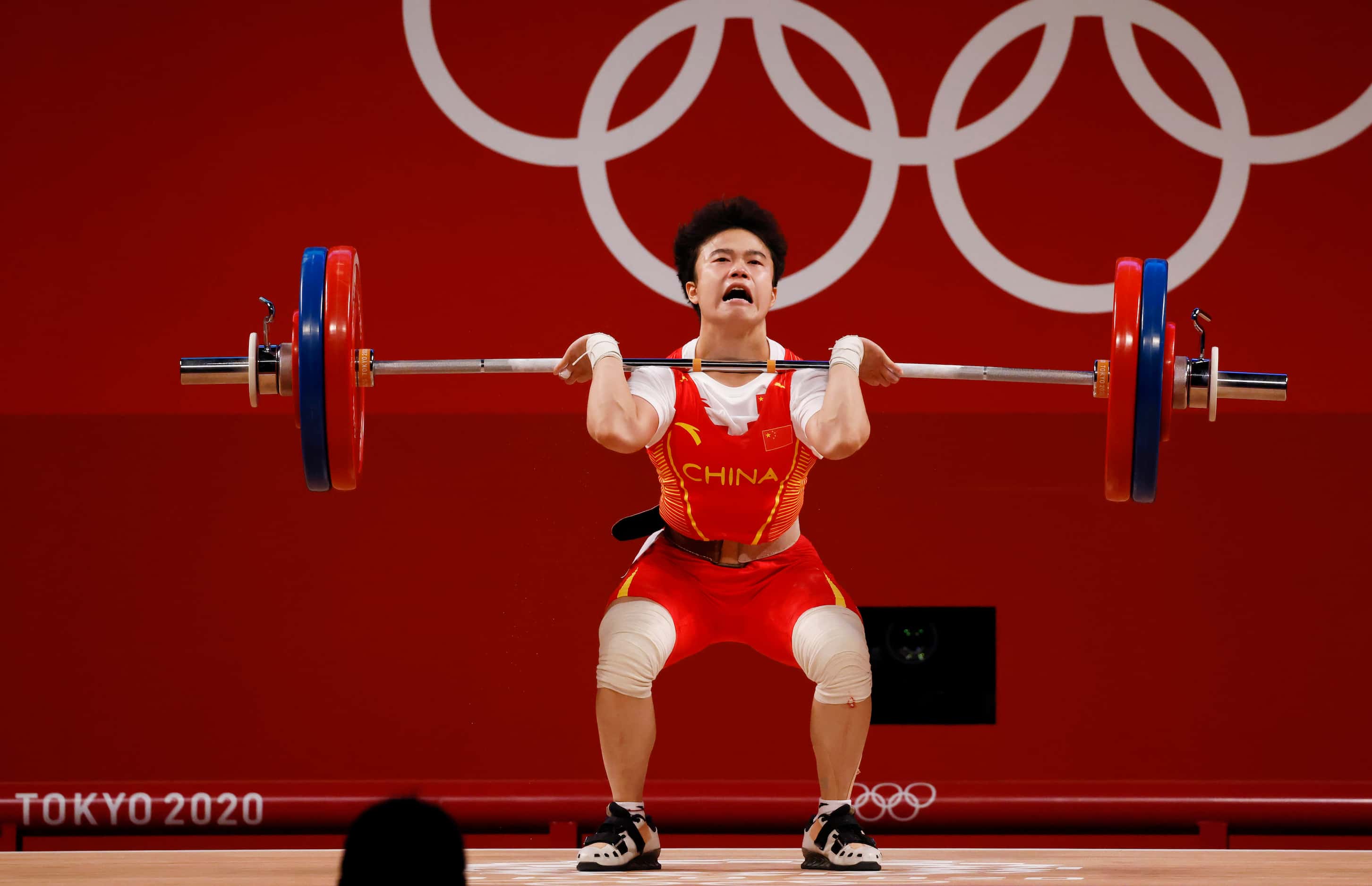 China’s Zhihui Hou lifts 116 kg an Olympic record on her third attempt in the clean and jerk...