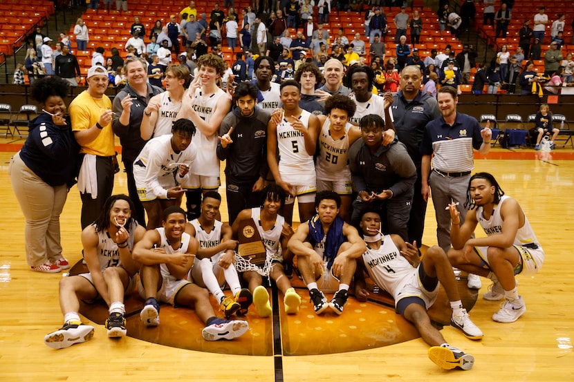 The McKinney boys basketball team poses for a photo after winning the Class 6A Region I boys...