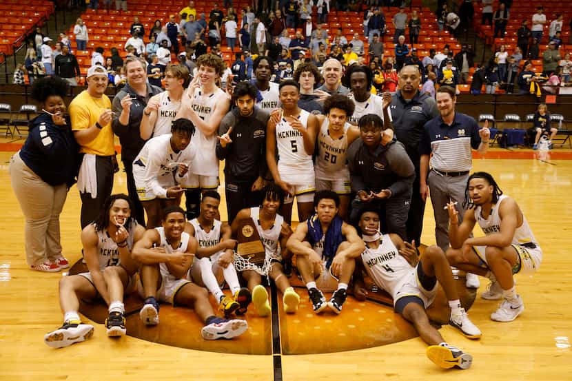 The McKinney boys basketball team poses for a photo after winning the Class 6A Region I boys...