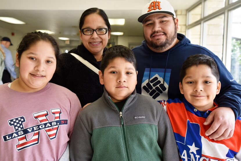 The Acosta family, from left, front row, Alyssa Acosta, 11, Austin Acosta, 9, Donovan...