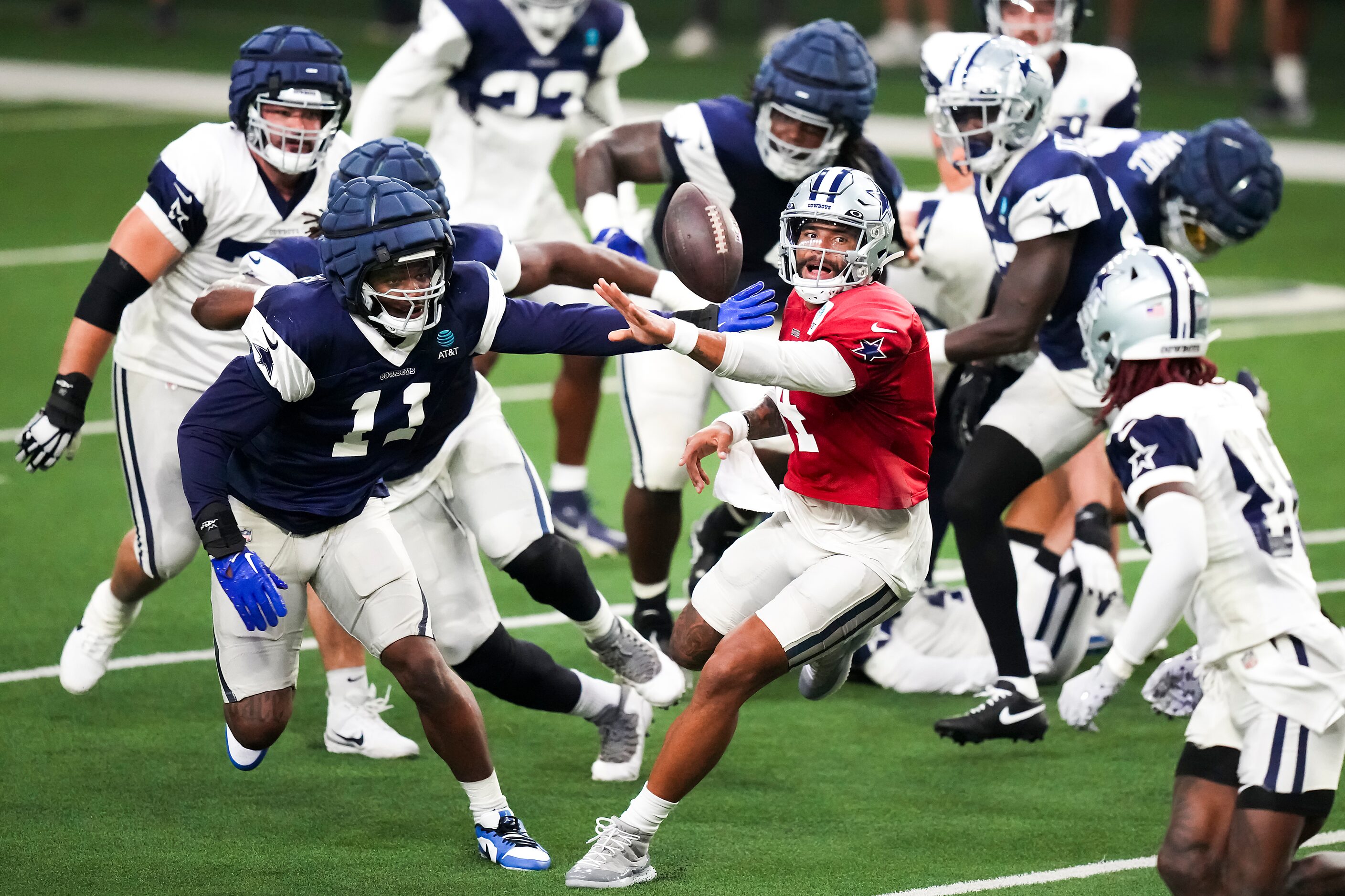 Dallas Cowboys quarterback Dak Prescott (4) pitches the ball to wide receiver CeeDee Lamb...