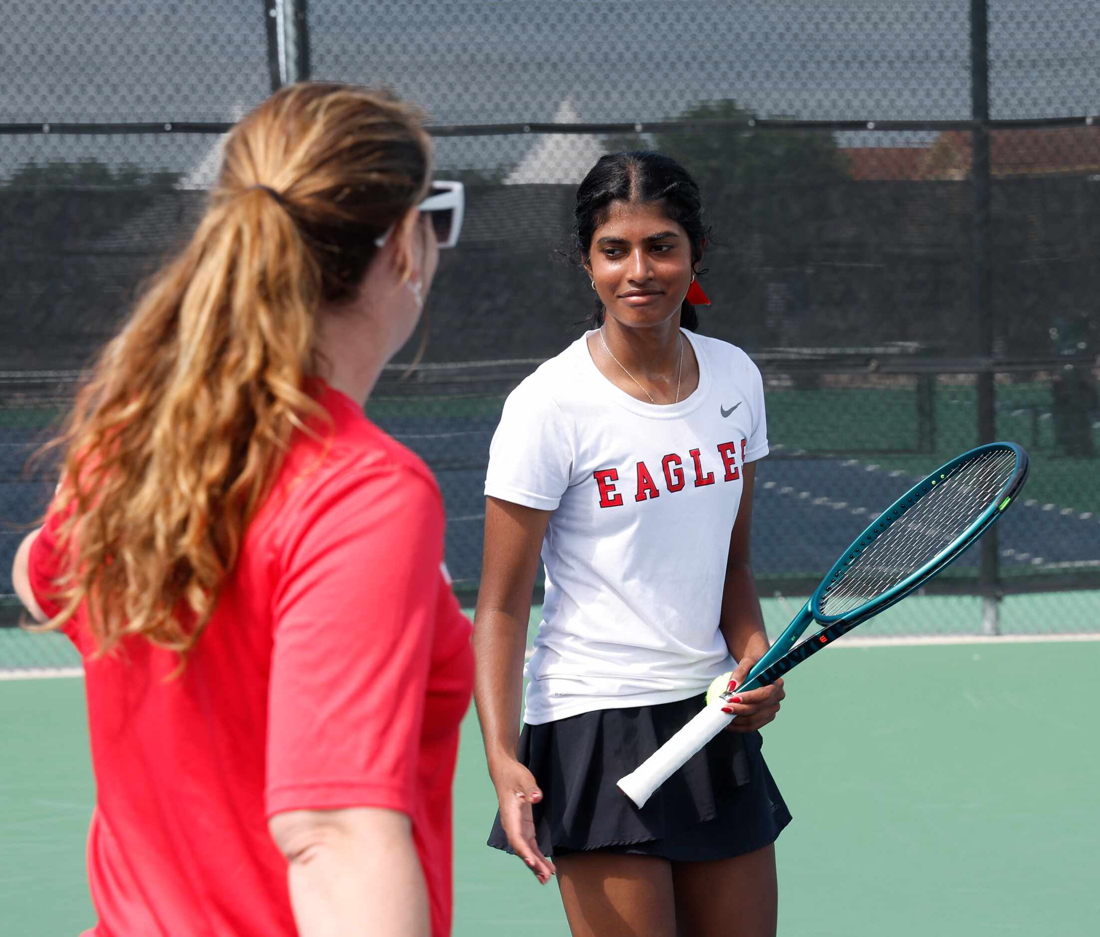 Meghna Arun Kumar, Argyle is congratulated by one of her coaches Danielle Blair after she...