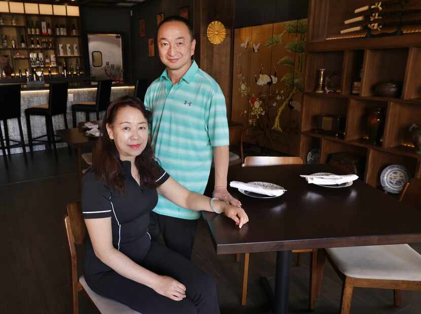 Gong Chao-Zhung, left, and Kang Fan-Jing pose for a photograph at Mockingbird Station's...