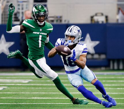 Dallas Cowboys wide receiver Jalen Tolbert (18) pulls in a second quarter reception in front...