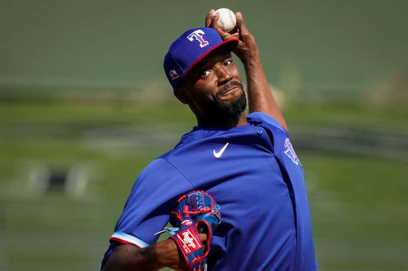 Texas Rangers pitcher Taylor Hearn pitches during the second inning of a spring training...
