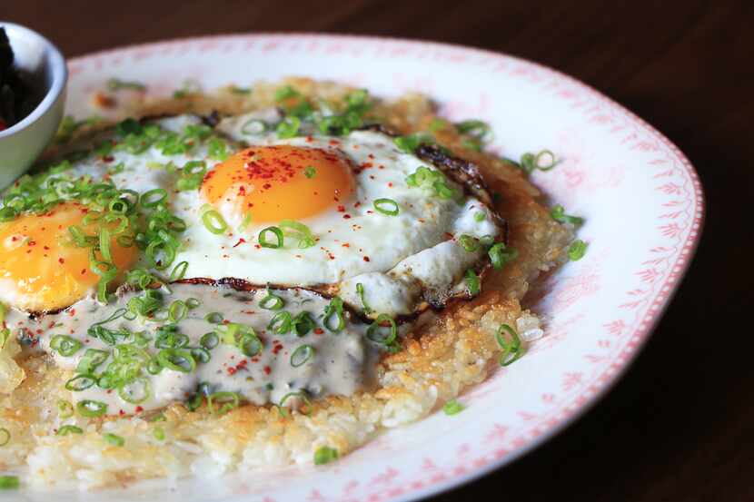 The Not Biscuits and Gravy from Gung Ho features a rice cake topped with gravy, eggs,...