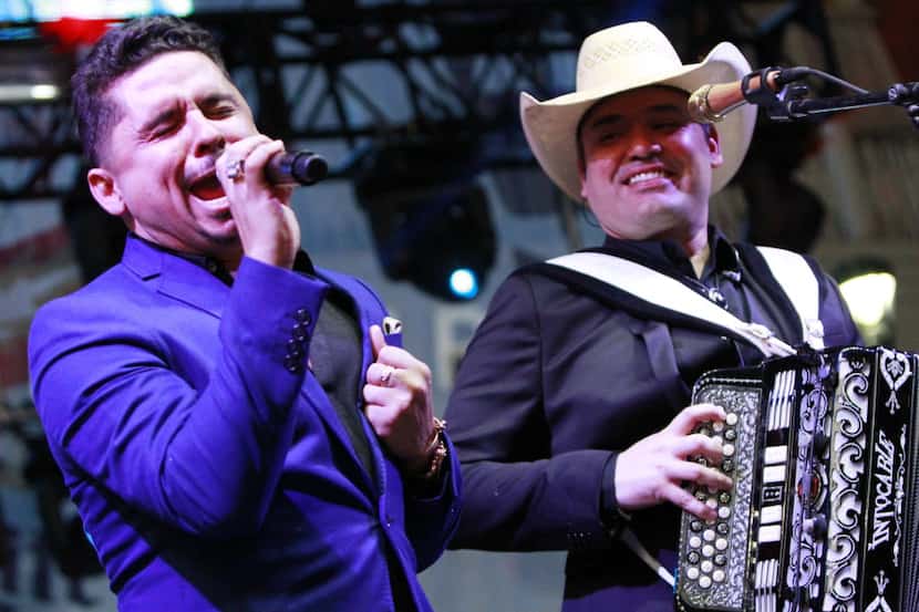 Larry Hernandez (left) sings with Ricky Munoz of the Tejano group Intocable during the...