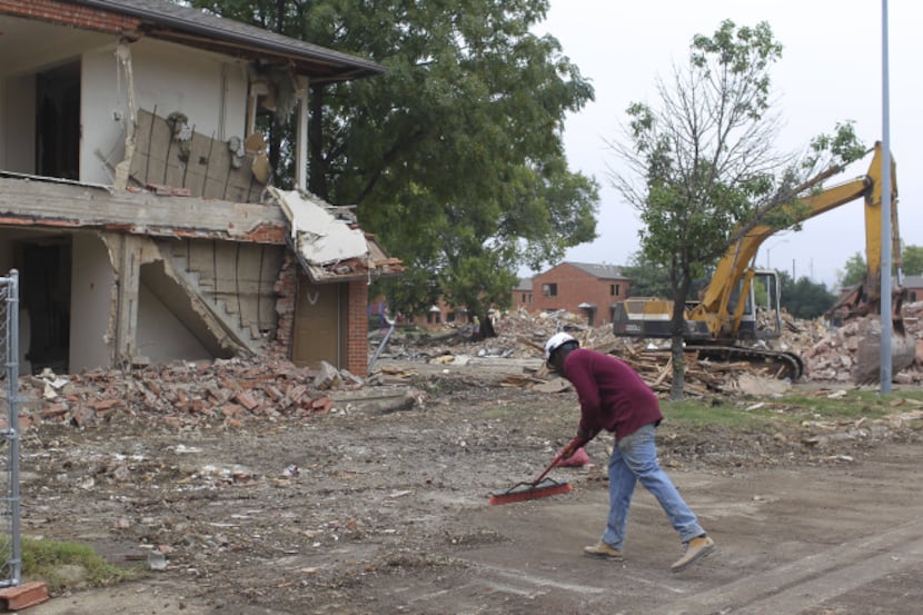 Demolition crews are busy tearing down the 70-year-old public housing project off Maple...