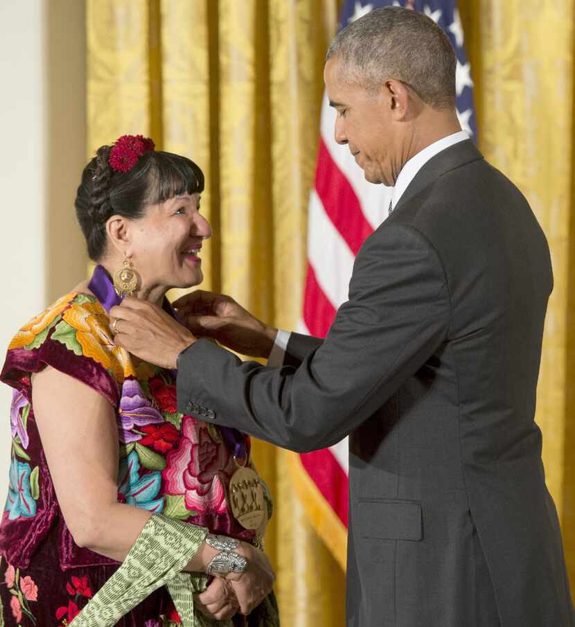  President Barack Obama presents author Sandra Cisneros with the 2015 National Medal of Arts...