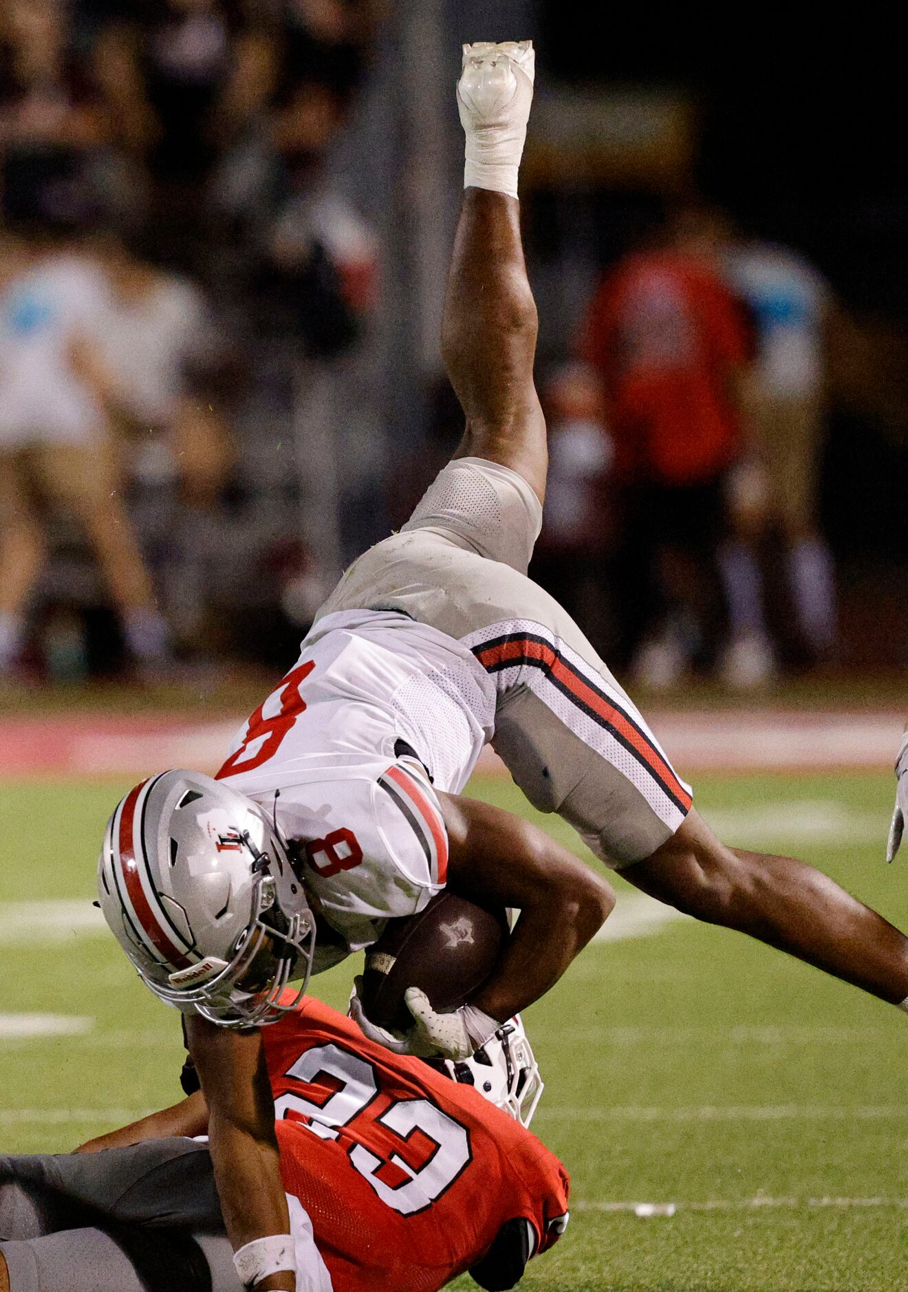 Lovejoy's Khalin Williams (8) jumps over Argyle's Xavier Sanchez (23) during the second half...