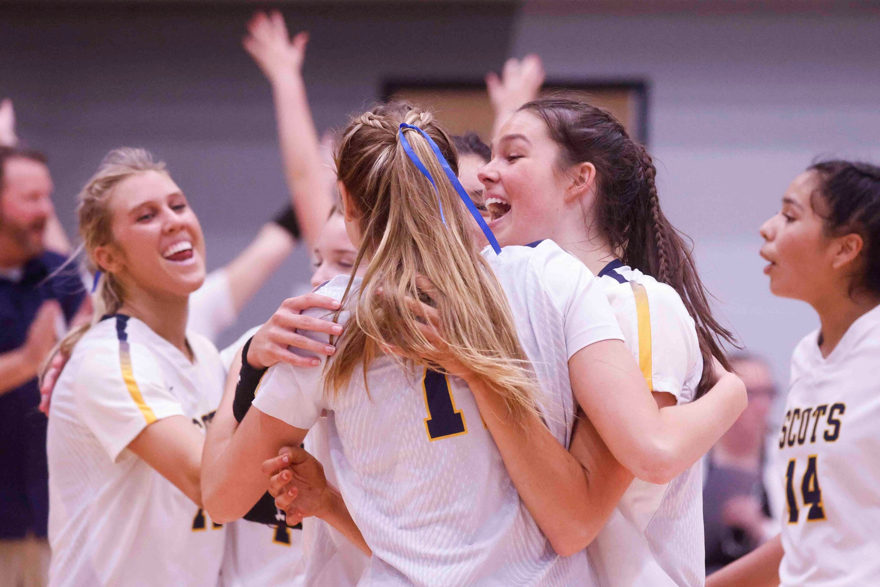 Highland Park players celebrate after winning against Flower Mound during a volleyball game...