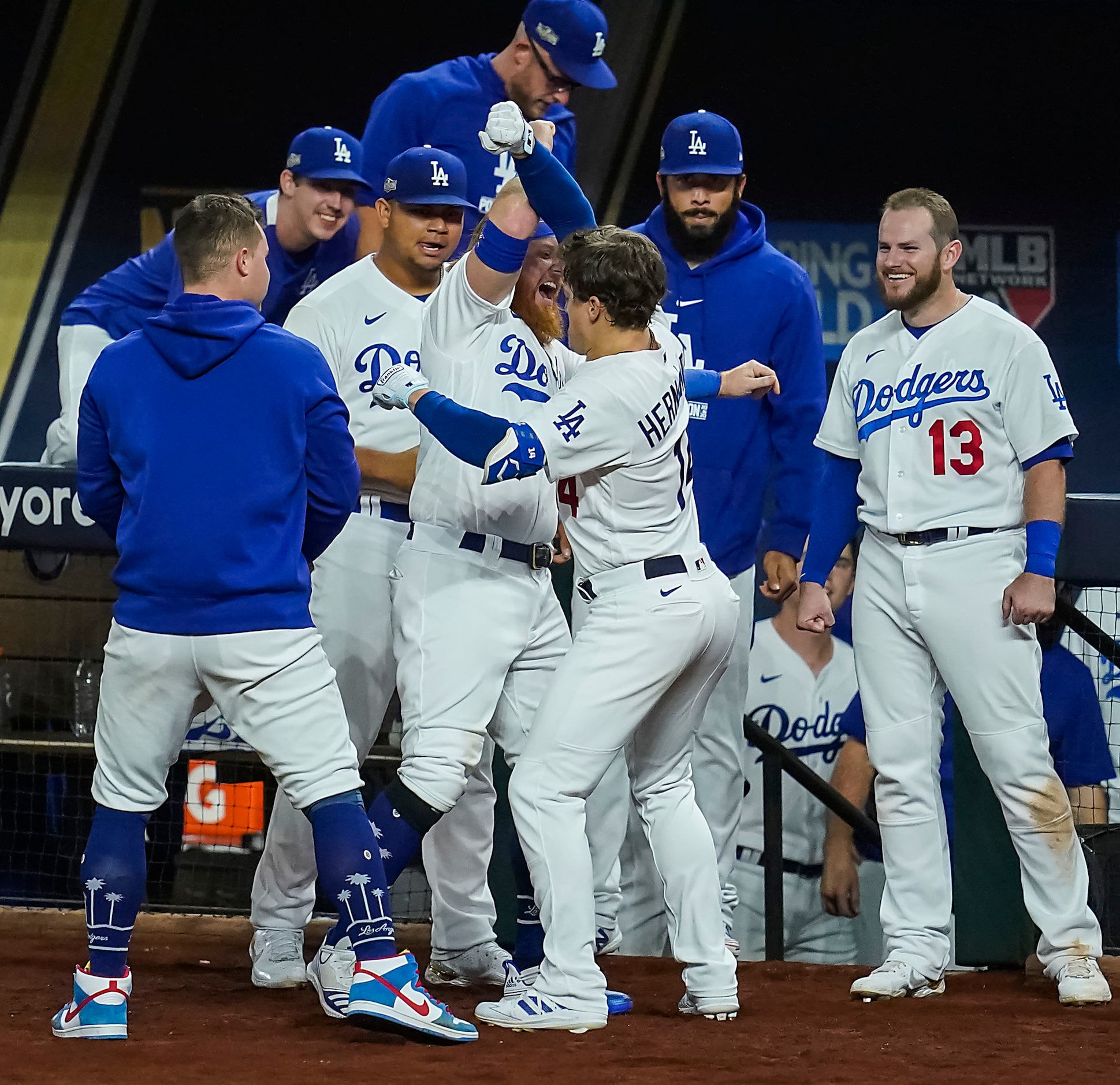 The Los Angeles Dodgers pinch hitter Enrique Hernandez (14) celebrates with third baseman...