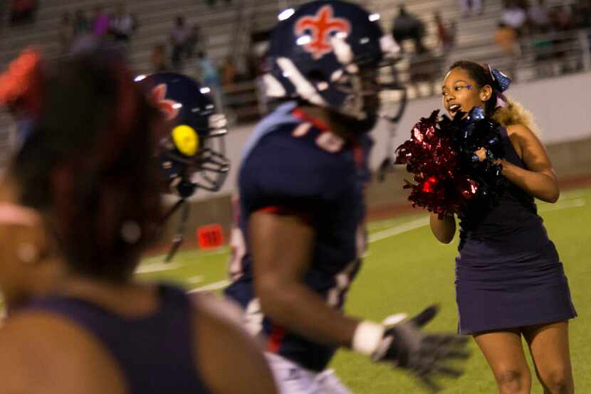 The Kimball cheerleaders welcome the Knights back to the field for the second half during...