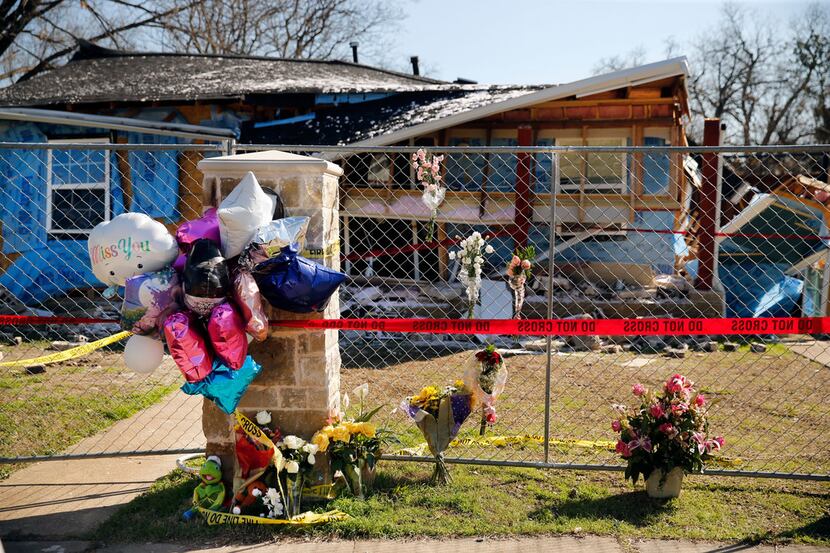 A memorial for 12-year-old Linda Michelle Rogers outside the home she was killed in when it...