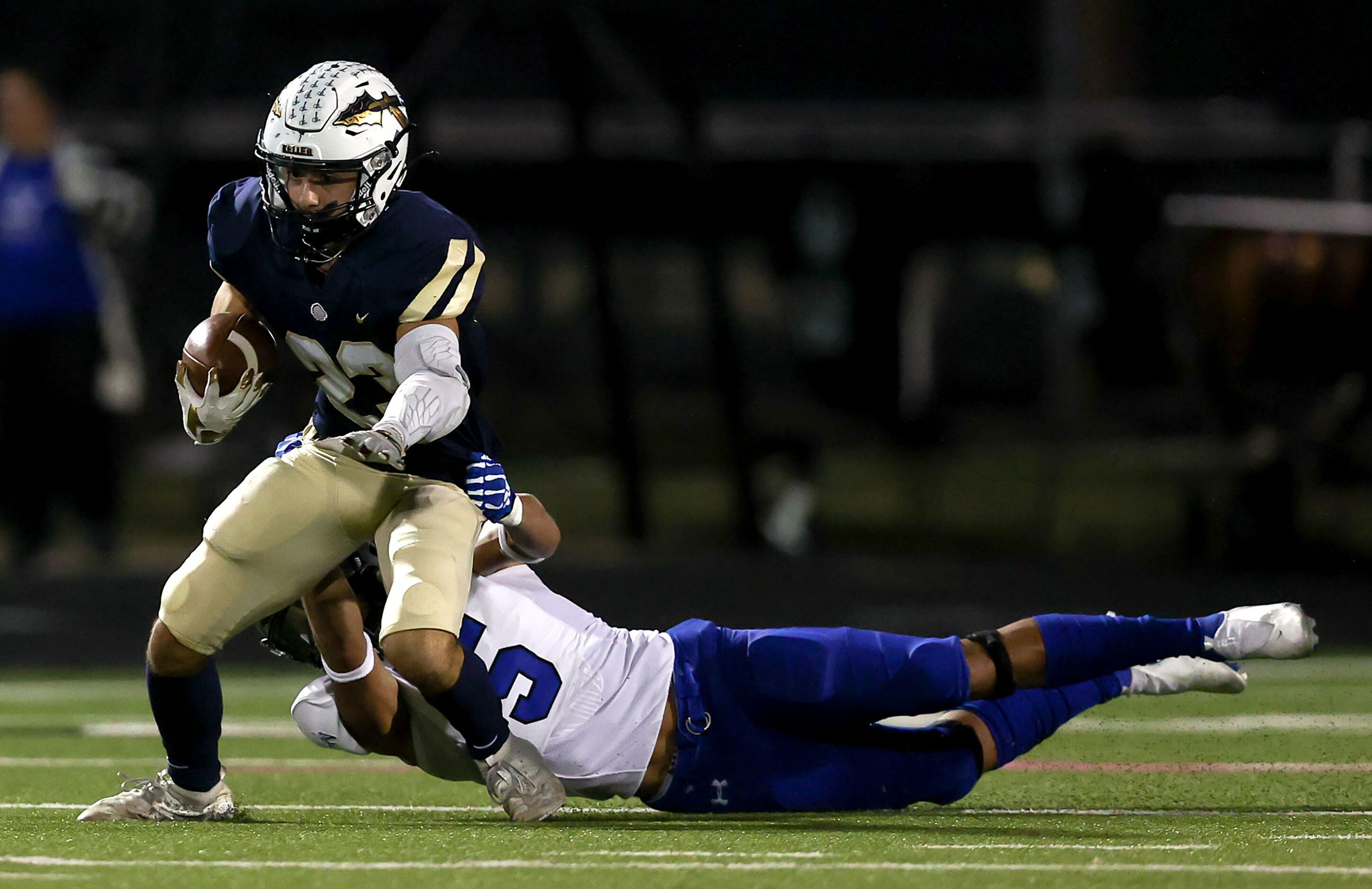 Keller running back Jackson Kraatz (23) tries to break at tackle against Byron Nelson...