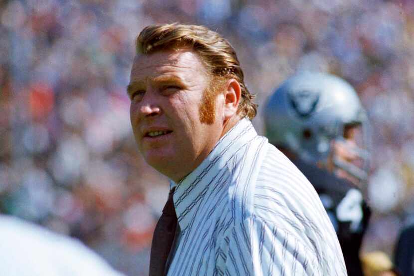 Oakland Raiders coach John Madden stands on the sideline during an NFL football game in...