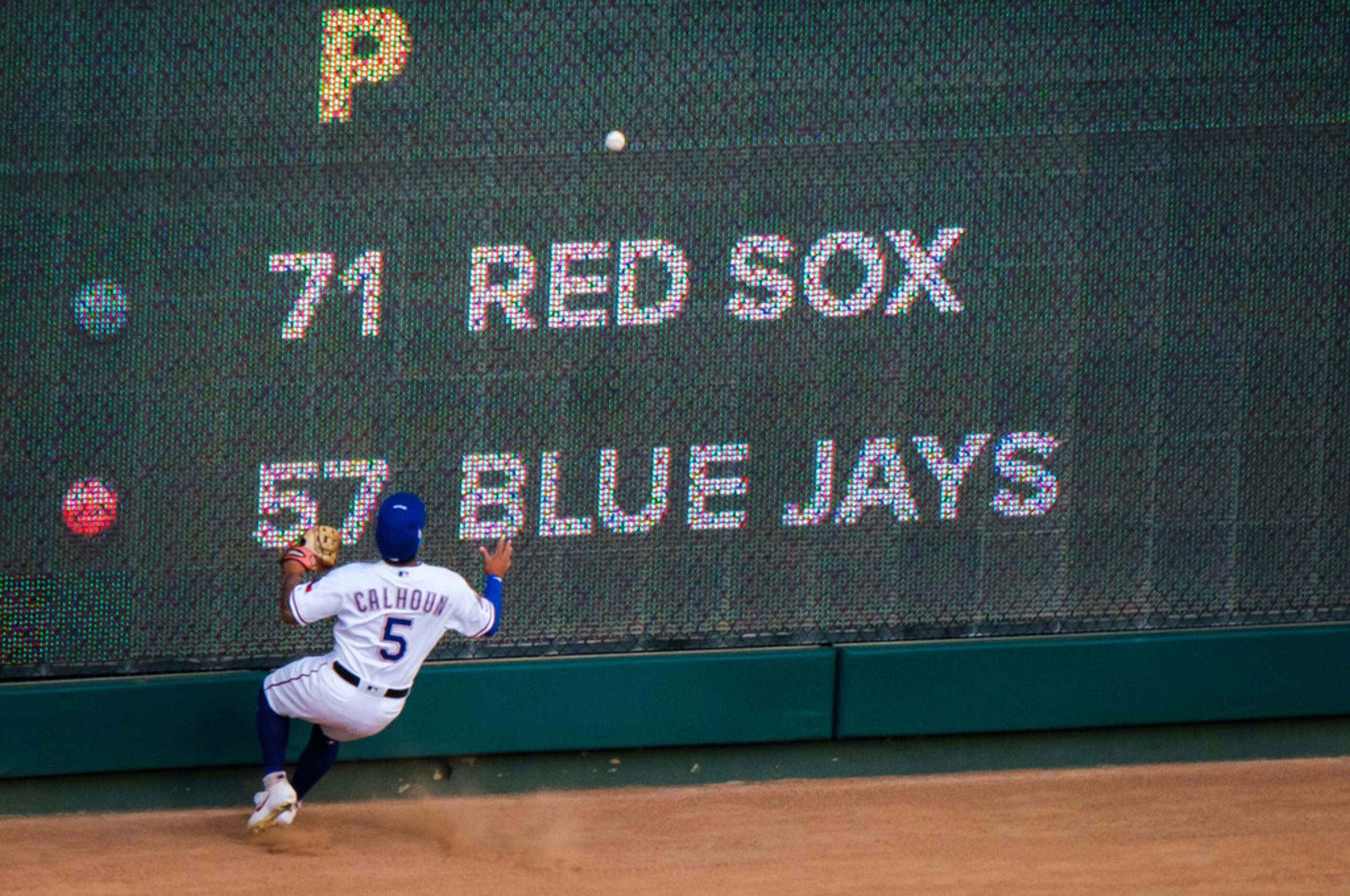 Texas Rangers outfielder Willie Calhoun canÃt make the play on a run-scoring double off the...