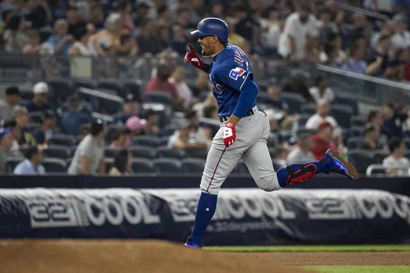 NEW YORK, NY - AUGUST 10: Ronald Guzman #67 of the Texas Rangers hits his third homerun of...