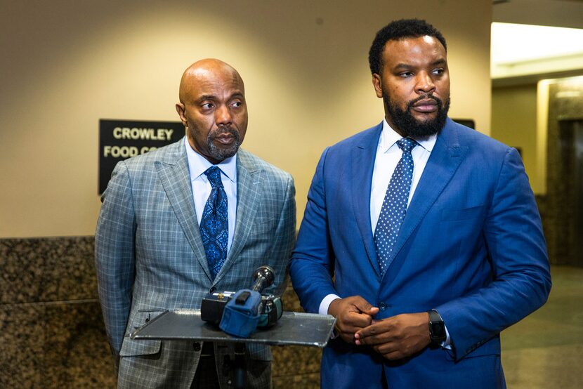 Jean family attorneys Daryl K. Washington, left, and Lee Merritt speak to the media at the...